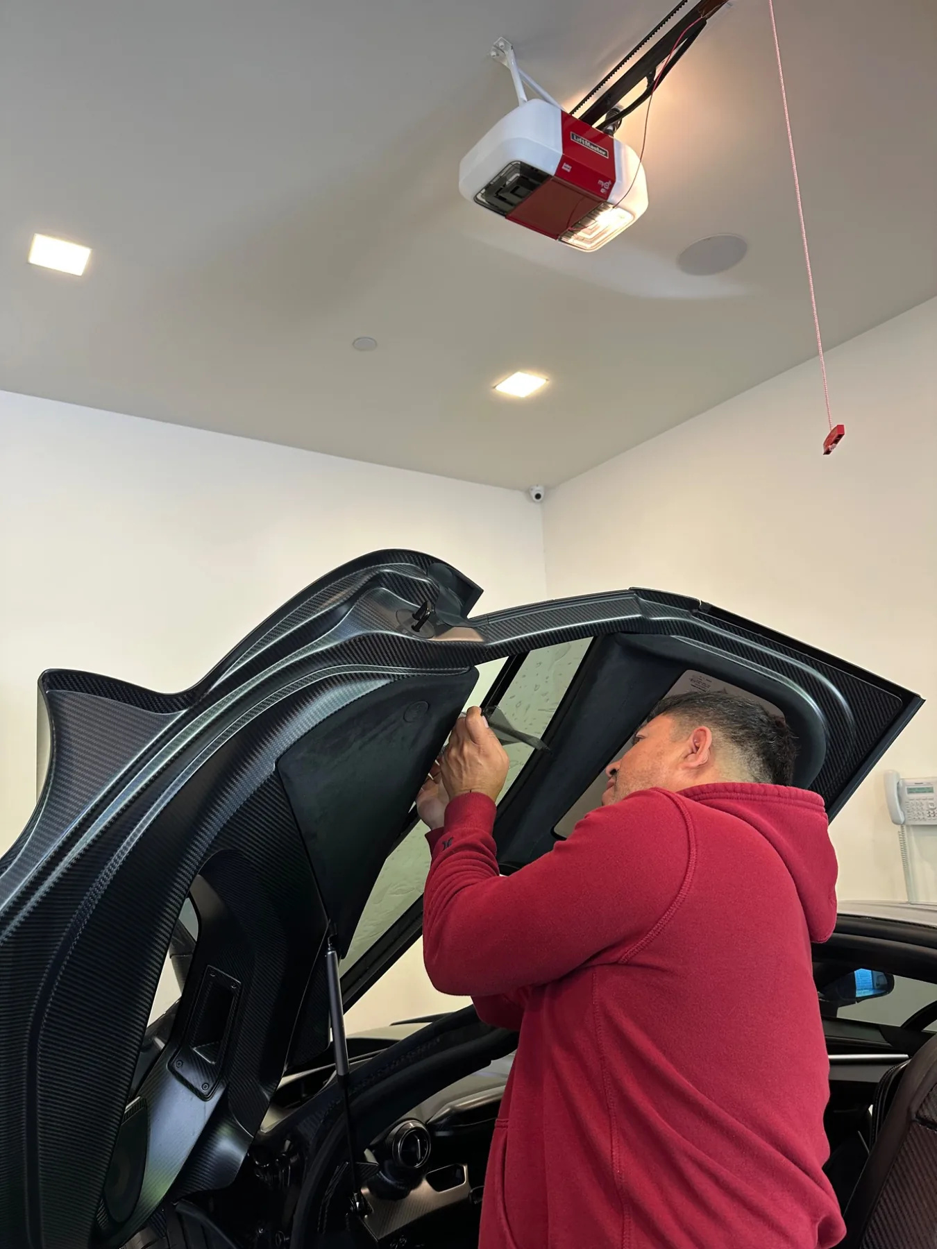 Close-up of window film installation on vehicle glass